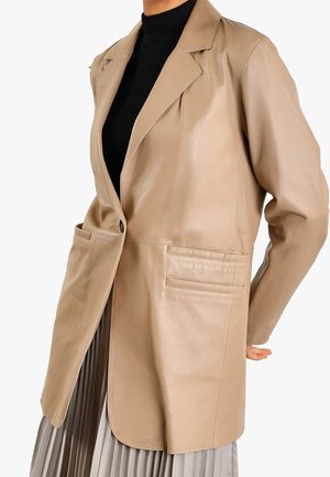 Halflange jas - beige
