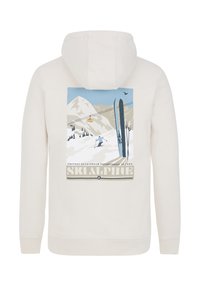 Felpa color crema con stampa grafica di montagne, sci e una funivia. Cappuccio con cordino, polsini a coste e vita a coste.