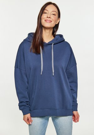 Marineblaues Kapuzen-Sweatshirt in lockerer Passform. Es verfügt über eine strukturierte Oberfläche, eine Kordel mit reflektierenden Akzenten und gerippte Bündchen.