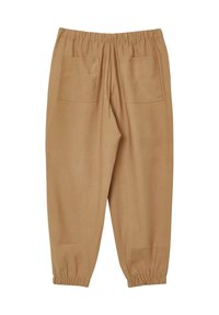 Pantaloni beige con vita elastica, dotati di due tasche posteriori e orli a girovita. Presentano una texture morbida e liscia e una vestibilità rilassata.