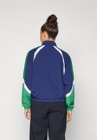 Under Armour ICON CRINKLE TRACK JACKET - Jakna za treniranje - midnight navy/team kelly green