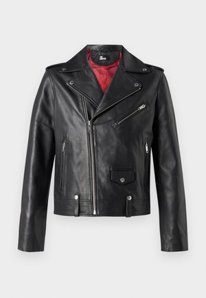 Black leather biker jacket with silver zippers and snap buttons, featuring a red interior lining and asymmetrical front closure.