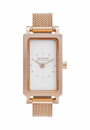 Prostokątny zegarek z różowego złota z białą tarczą, minimalistycznymi indeksami godzin, dwiema wskazówkami i bransoletą typu mesh, marki Skagen Denmark.