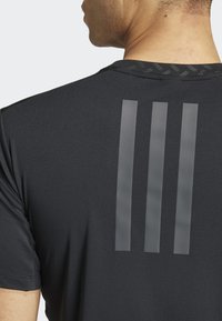 adidas Performance POWER WORKOUT - Sports T-shirt - black carbon