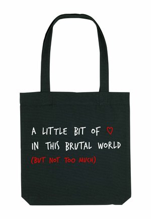 Sac en toile noir avec texte blanc et rouge : "UN PEU DE ❤️ DANS CE MONDE BRUTAL (MAIS PAS TROP)." Design simple, poignées robustes.