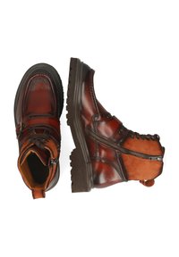 Botines de cuero marrón y ante con suela resistente, parte frontal con cordones, cierre de cremallera y costuras decorativas. Diseño de color bicolor.