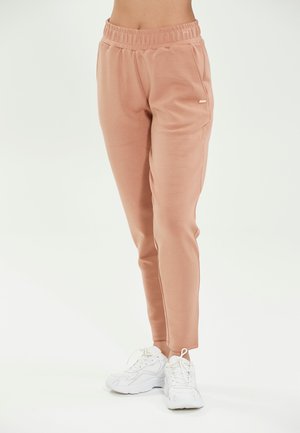 Athlecia Tracksuit bottoms - mocha mousse