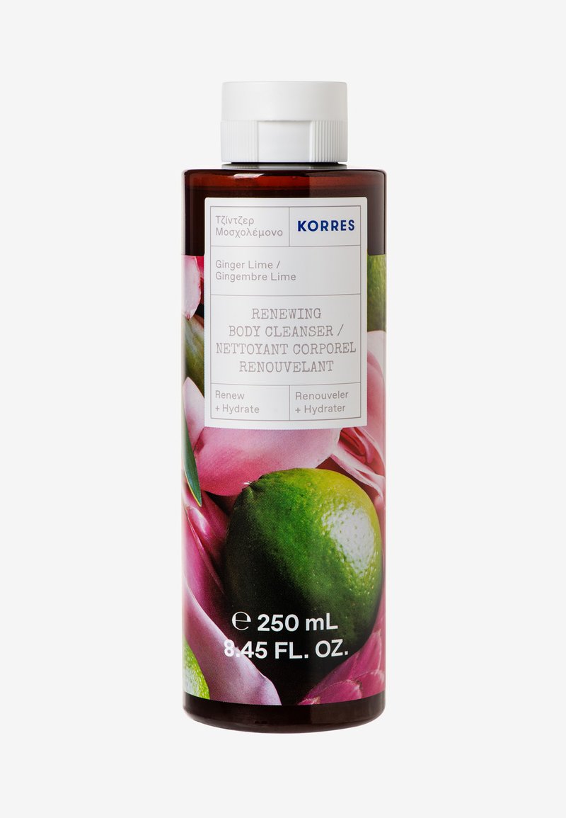 Bruine plastic fles met een witte dop. Het etiket bevat groene tekst en een bloemend ontwerp en geeft aan dat het product een 250 ml Ginger Lime lichaamsreiniger is.