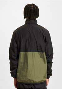 UNFAIR ATHLETICS Poletna jakna - black green