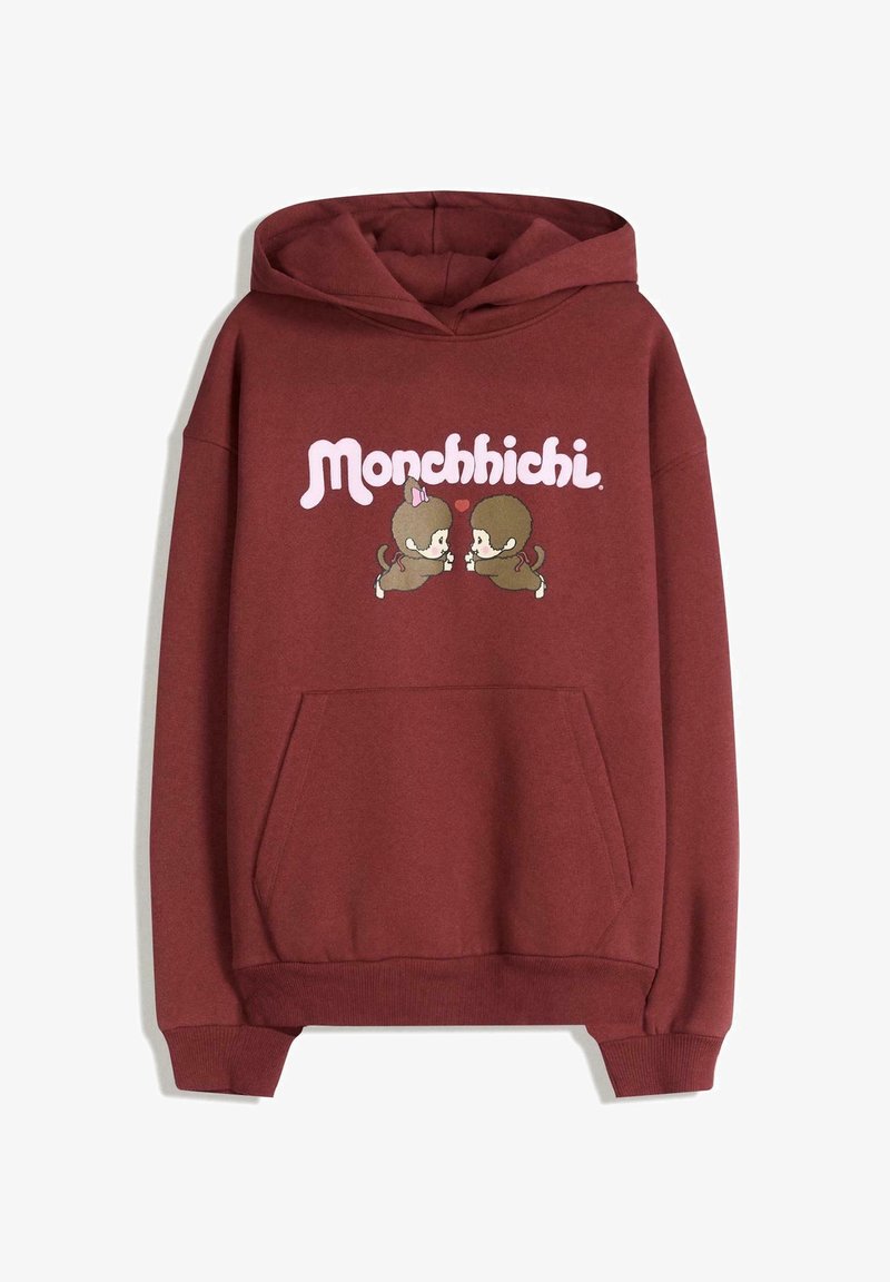 Sweat à capuche marron avec poche avant, avec le texte « Monchhichi » et deux singes dessinés se faisant face avec un petit cœur rouge entre eux.