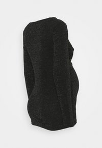 Černý dlouhý rukáv top se přiléhavým střihem, texturovaný materiál s stříbrnými tečkami a bočním řasením pro tvarující vzhled.