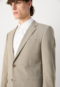 BOSS HUGE - Uzvalks - open beige