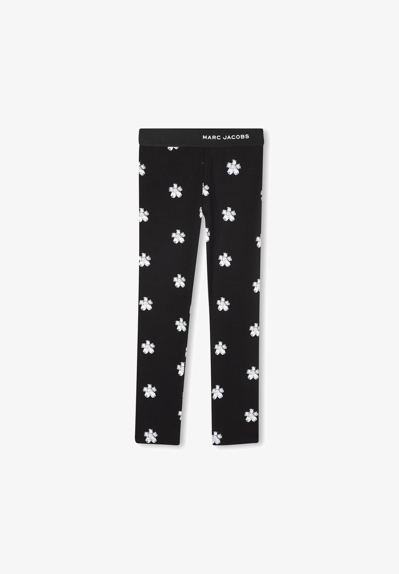 Leggings negros con una cintura con el logo de Marc Jacobs, que presentan patrones florales blancos distribuidos uniformemente por la tela para un aspecto texturizado.