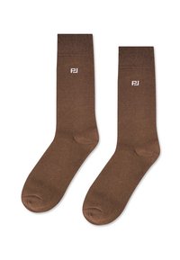 Brązowe skarpetki bawełniane o gładkiej fakturze, z ściągaczami i małym białym logo po boku. Wysokość do kostki z zaokrąglonymi palcami.