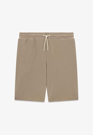 Beige, gestructureerde stoffen shorts met een elastische tailleband en een witte trekkoord, met een subtiel "GUESS"-logo op het onderste linkerbeen.