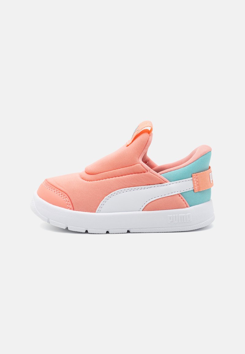 Lightweight slip-on shoes with a coral fabric upper, white rubber sole, and turquoise accent at the heel. Features minimal stitching details.