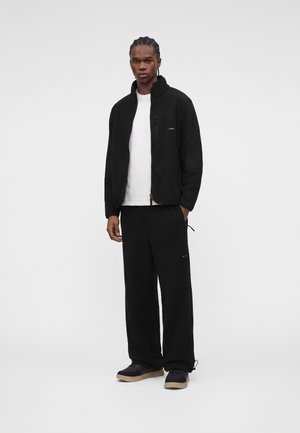 ARKK Copenhagen, ELDA PANTS UNISEX - Долнище на анцуг - black