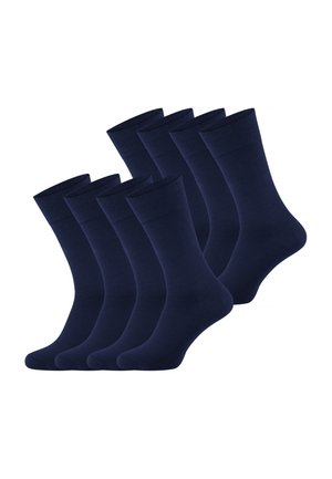 Acht paar donkerblauwe sokken op scheepmanslengte, gerangschikt in twee rijen op een witte achtergrond.