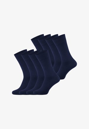 Acht Paare dunkelblaue Crew-Socken, aufgereiht in zwei Reihen auf weißem Hintergrund.