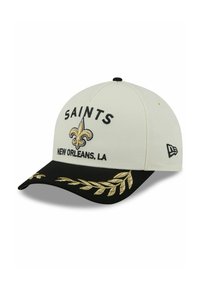 Cap features a white fabric body with a black visor. Embroidered "SAINTS" and a gold fleur-de-lis logo on the front. Gold leaf accents.