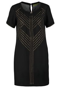 Robe noire à manches courtes avec des motifs de clous géométriques dorés sur le devant et une petite fermeture à clip au niveau de l'encolure.