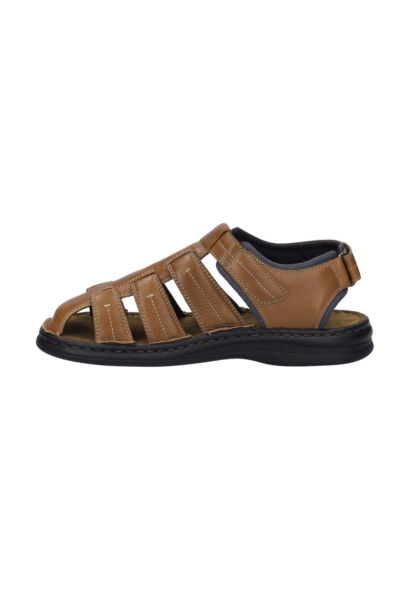 Brown leather sandal featuring an open design with multiple straps, stitched details, and a durable black rubber sole.