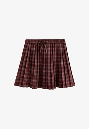 Red plaid pleated skirt with an elastic waistband and tie detail. Features vertical and horizontal lines in contrasting light colors.