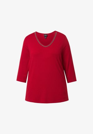 Top in cotone rosso con maniche a tre quarti, scollo a V abbellito con un bordo argentato. Tessuto morbido, vestibilità comoda e senza fantasie.
