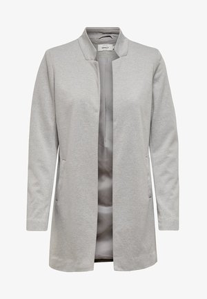 Cardigan lungo grigio chiaro in tessuto morbido. Presenta un'apertura frontale, senza chiusure, e due tasche laterali.