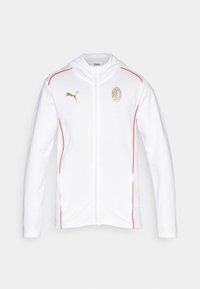 Hvid hoodie-jakke med røde detaljer, guld Puma-logo og AC Milan-crest. Har en fuld lynlås og hætte, lavet af glat stof.