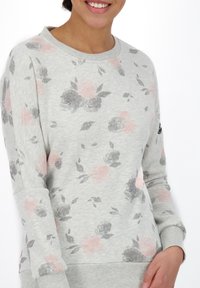 Light gray sweatshirt featuring a floral pattern in pink and gray. Ribbed cuffs and hem, round neckline, made from soft cotton blend fabric.
