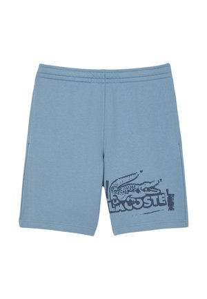 Shorts en coton bleu clair avec un logo graphique noir Lacoste, taille élastique, deux poches latérales et une coupe décontractée.