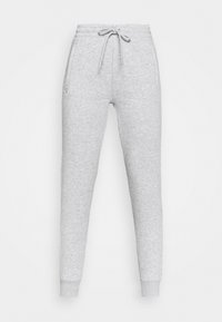 Grijze joggingbroek met een tailleband met trekkoord, taps toelopende pijpen en zijzakken, gemaakt van zachte stof met een gladde textuur. Minimale zichtbare branding.