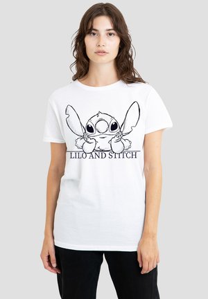 White cotton t-shirt featuring a black outline graphic of Stitch from "Lilo and Stitch," with text below in a bold font. Short sleeves, standard fit.