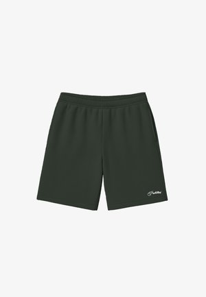 Shorts taille élastique vert foncé avec poches latérales et petit texte blanc « Interdit » sur la partie inférieure de la jambe gauche.