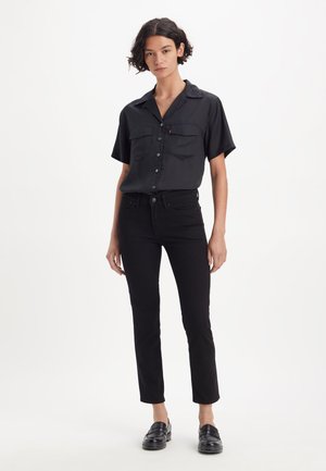 712™ SLIM WELT POCKET - Vaqueros slim fit - night is black