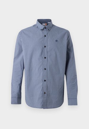 Langermet skjorte med blått og grått rutemønster, knappet ned krage og liten brodert logo på brystet.