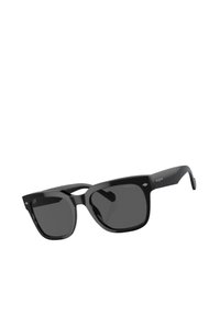 Occhiali da sole neri con una montatura spessa, lenti quadrate e una finitura lucida. Presentano sottili dettagli a forma di diamante sulla parte anteriore.