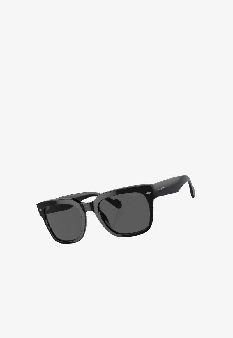 Occhiali da sole neri con una montatura spessa, lenti quadrate e una finitura lucida. Presentano sottili dettagli a forma di diamante sulla parte anteriore.