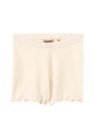Cremfarbene gerippte Shorts mit einem gewellten Saum, ausgestattet mit einem elastischen Bund. Das Etikett trägt die Aufschrift "WHEAT" und die Größe "4Y."