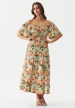 Floral maxi dress with off-the-shoulder sleeves, featuring a mix of orange, green, and white patterns on a brown background. Flared skirt design.