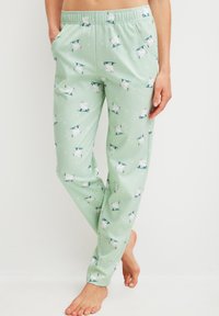Lichtgroene pyjamabroek met een feestelijk patroon van ijsberen, elastische tailleband, twee zijzakken en zachte, gladde stof.