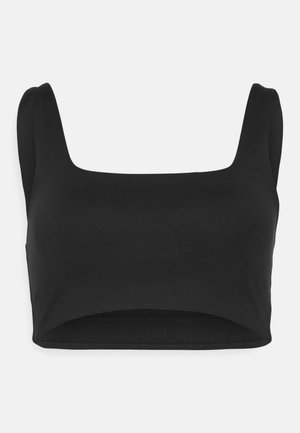 Musta lyhythihainen toppi, jossa on neliömäinen pääntie, leveät hihnat ja tiukka vyötärö. Valmistettu sileästä, venyvästä materiaalista. Minimalistinen muotoilu ilman kuvioita.