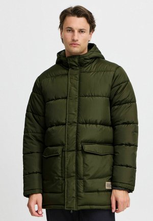 Olive green puffy jacket with a hood, featuring a zip closure, two front pockets, and stitched detailing. Smooth, insulated fabric.