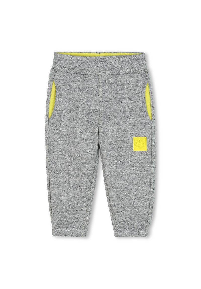 Grijze sweatpants met een zachte textuur, voorzien van gele zakvoering, een elastische tailleband en een klein logo op de voorkant.