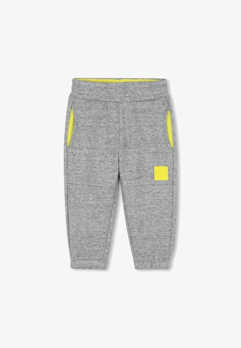 Grijze sweatpants met een zachte textuur, voorzien van gele zakvoering, een elastische tailleband en een klein logo op de voorkant.