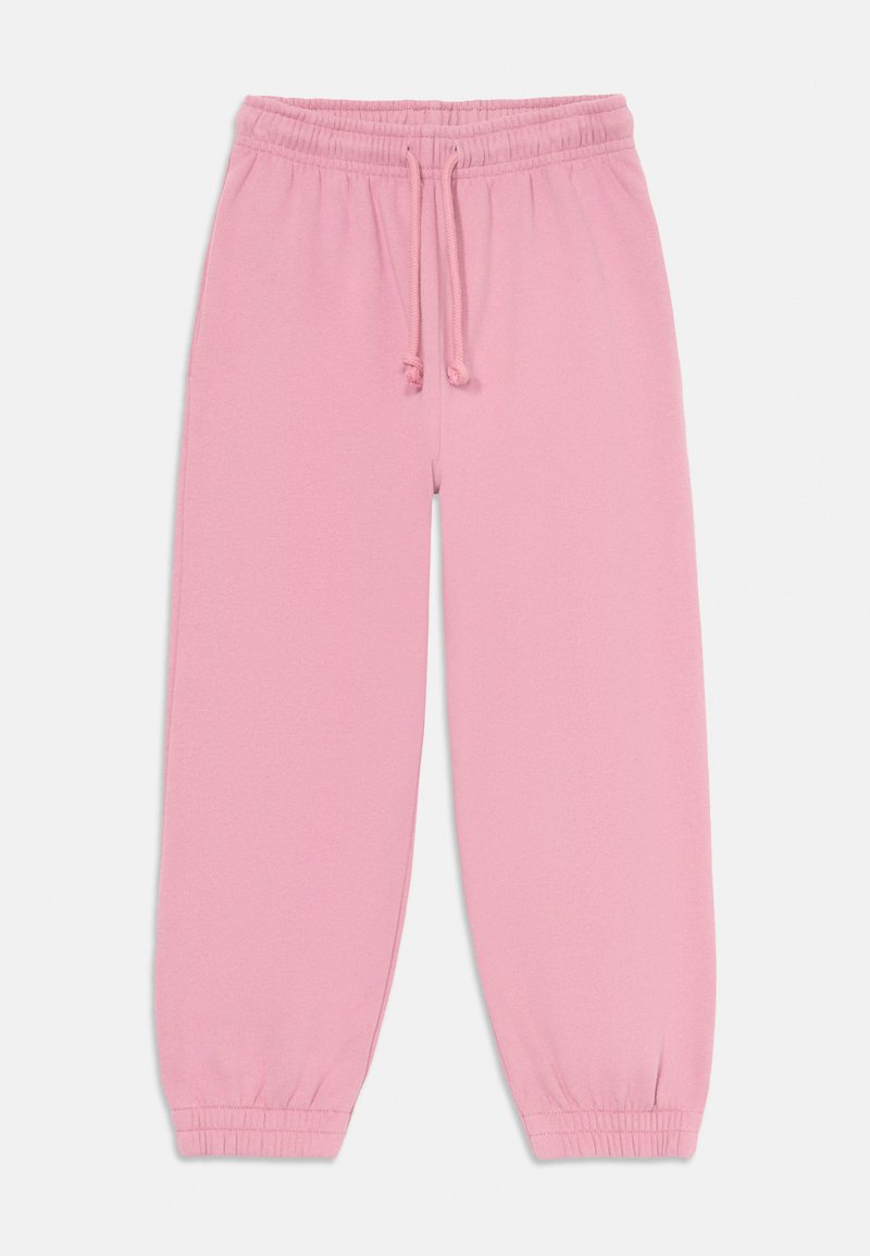 Calças de treino cor-de-rosa com um cós elástico e cordão ajustável. Com punhos nos tornozelos, feitas de um tecido suave e liso.