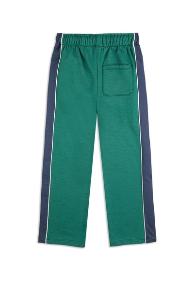 Zelene trenirke s tamnoplavim bočnim panelom, elastičnim pojasom i jednom stražnjom džepom. Imaju bijele trake duž bočnih šavova.