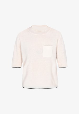 Vaaleancremekerrosholkavat takki pehmeästä neulemateriaalista, jossa on etutasku ja musta kontrasti hihansuissa sekä helmassa.