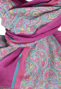 Lightweight, patterned scarf in pink and blue with intricate floral and paisley designs, featuring a smooth texture and draping fabric.